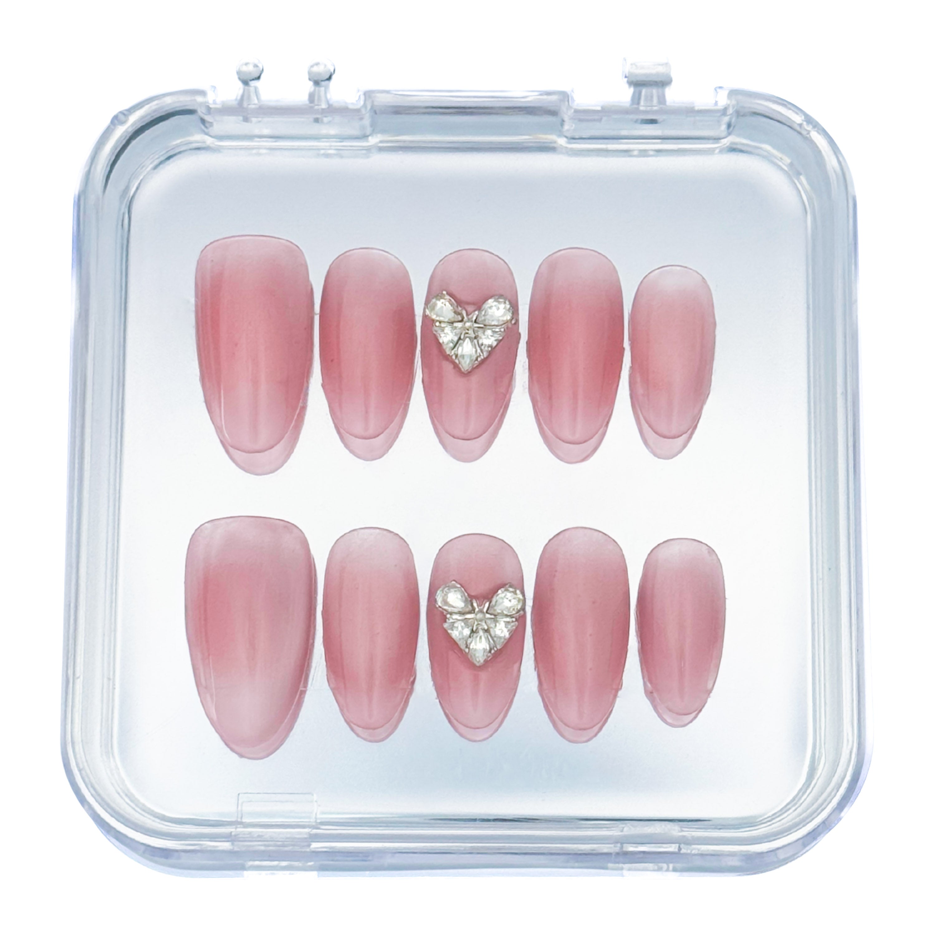 Lunoxcore Magnetic Love press-on nails — blush pink ombré design with crystal heart embellishments from the Whispered Shine Glowbox collection