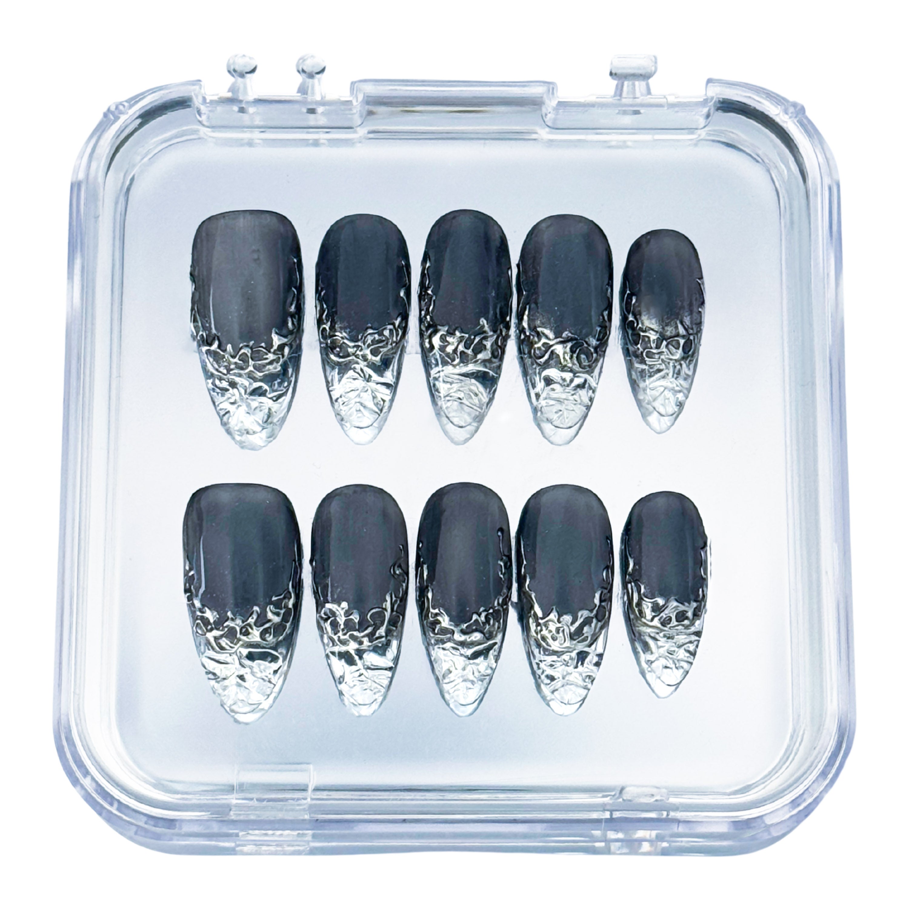 Lunoxcore Molten Glass press-on nails — matte black and silver chrome design inspired by molten metal from the Loudcore Glowbox collection.