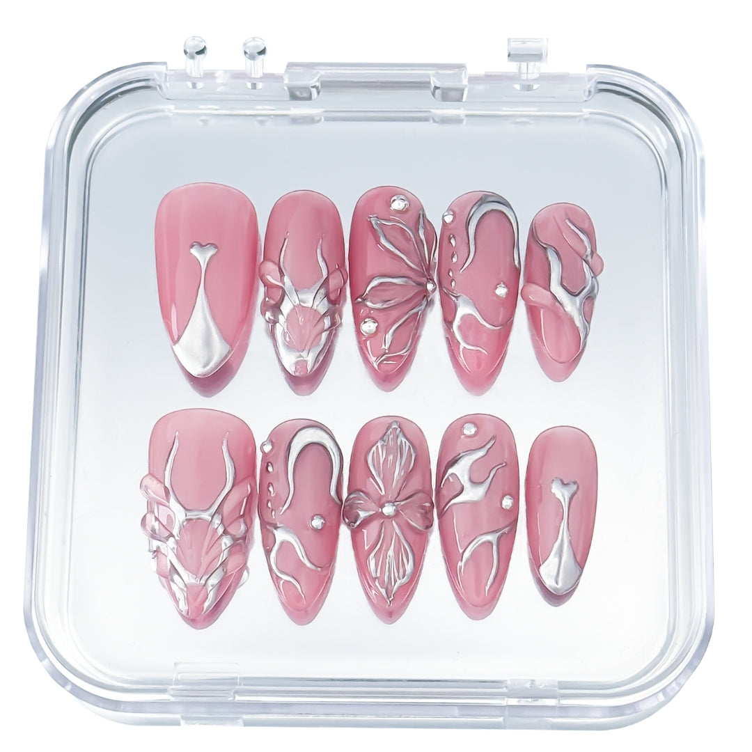 Lunoxcore Pink Dimension press-on nails — bright pink and white chrome swirl design with sculptural accents from the Loudcore Glowbox collection