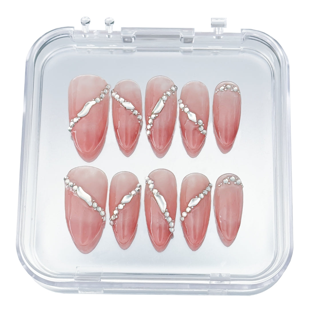 Lunoxcore Sunlit press-on nails — warm peachy pink design with crystal accents and radiant shine from the Evening Glow Glowbox collection.