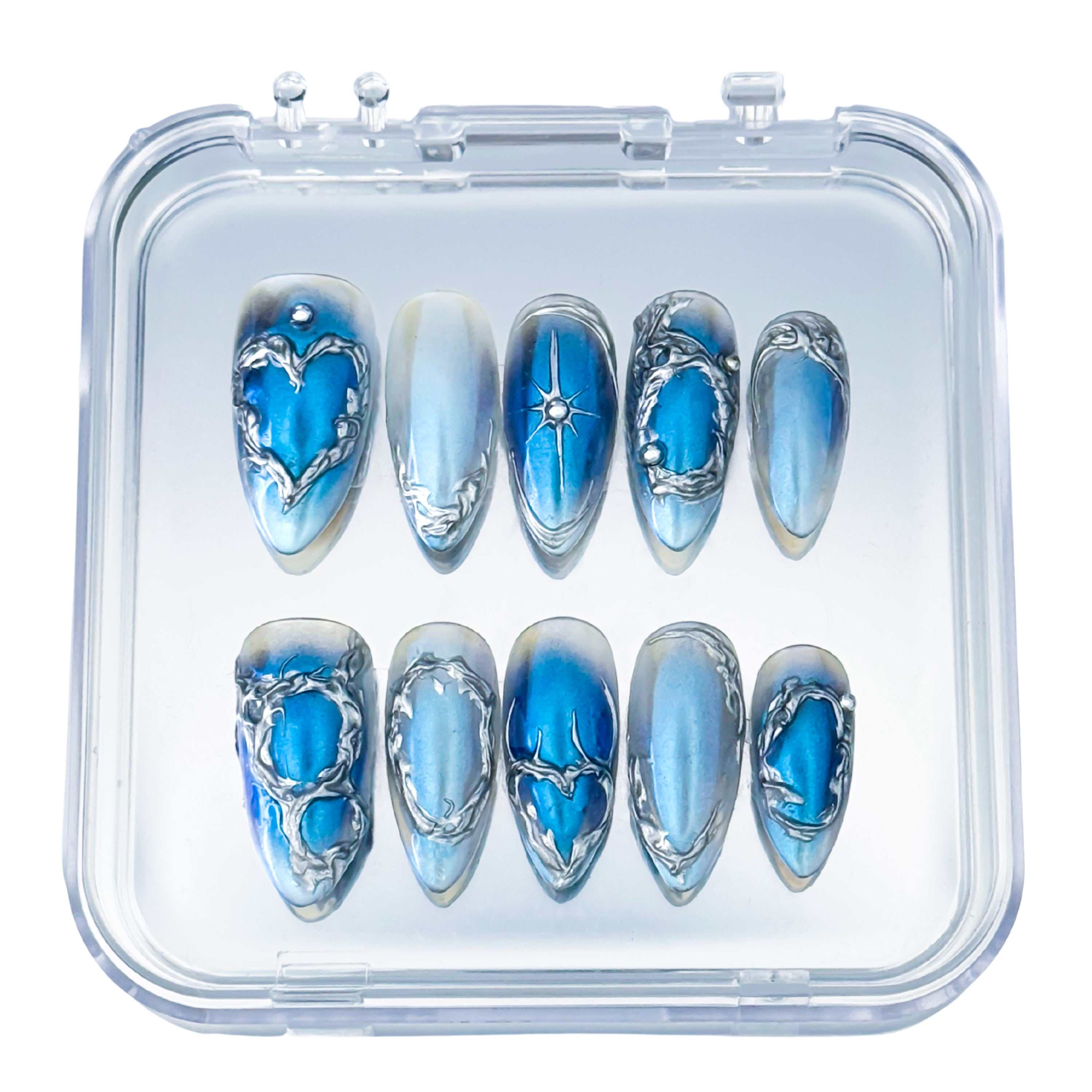 Lunoxcore Voltage press-on nails — vibrant blue and silver lightning-inspired design with futuristic metallic detailing from the Loudcore Glowbox collection.