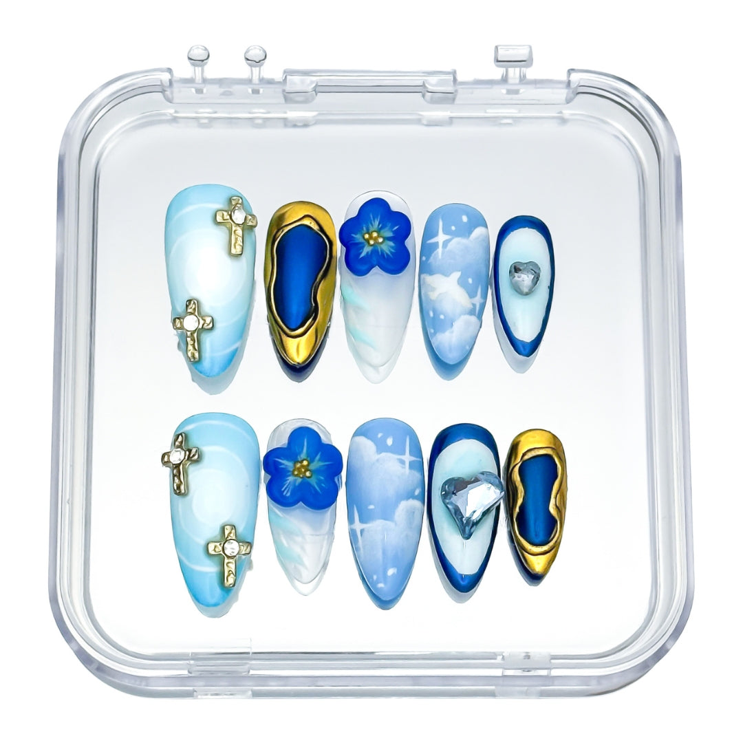 Handcrafted blue and gold 3D press-on nail set with cross and flower charms – Lunoxcore Heavenly Light Collection