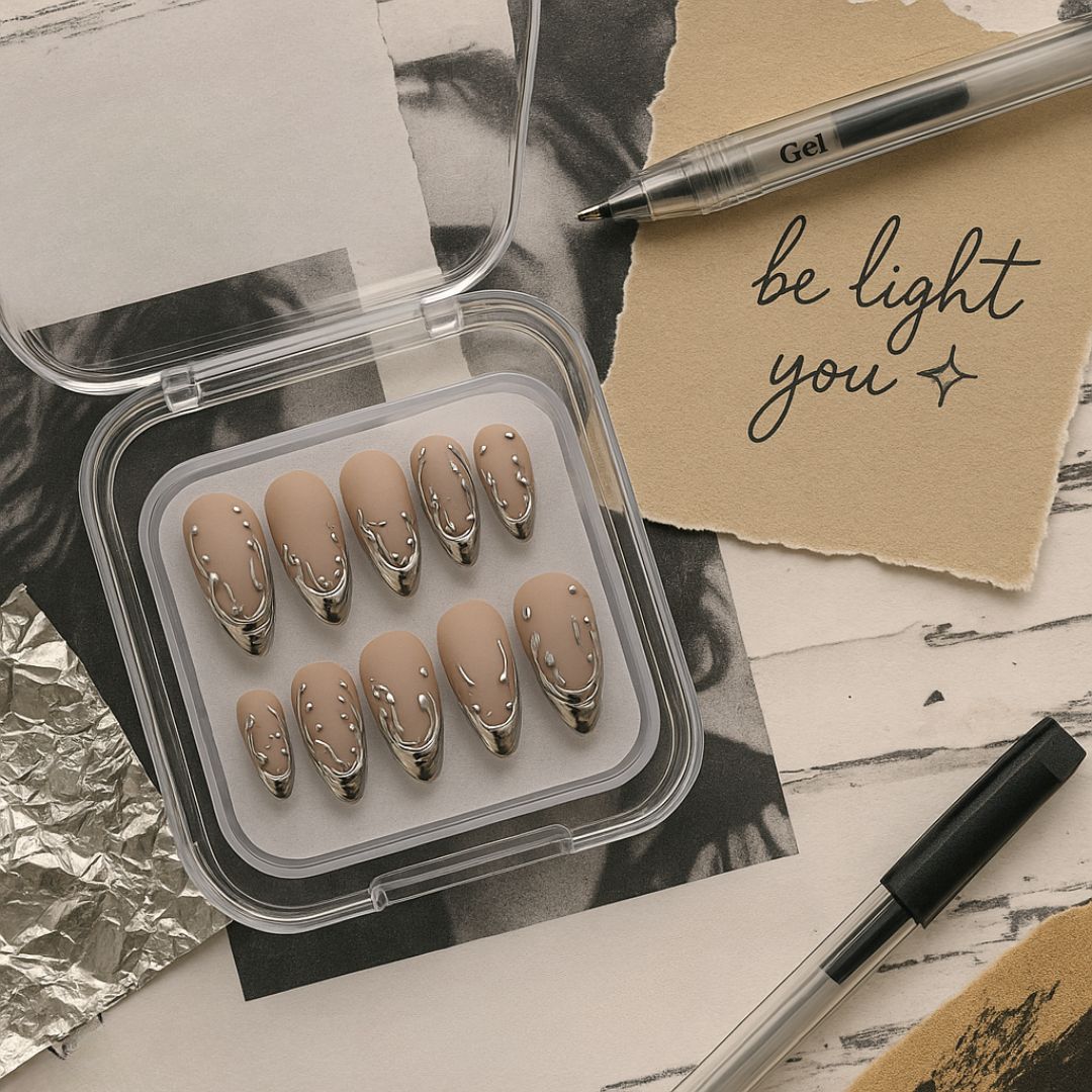 Lunoxcore press-on nails in a compact case with metallic silver drip design, placed beside a note that reads “Be Light You.” A cozy, aesthetic flat lay used in the Lunoxcore email signup popup.