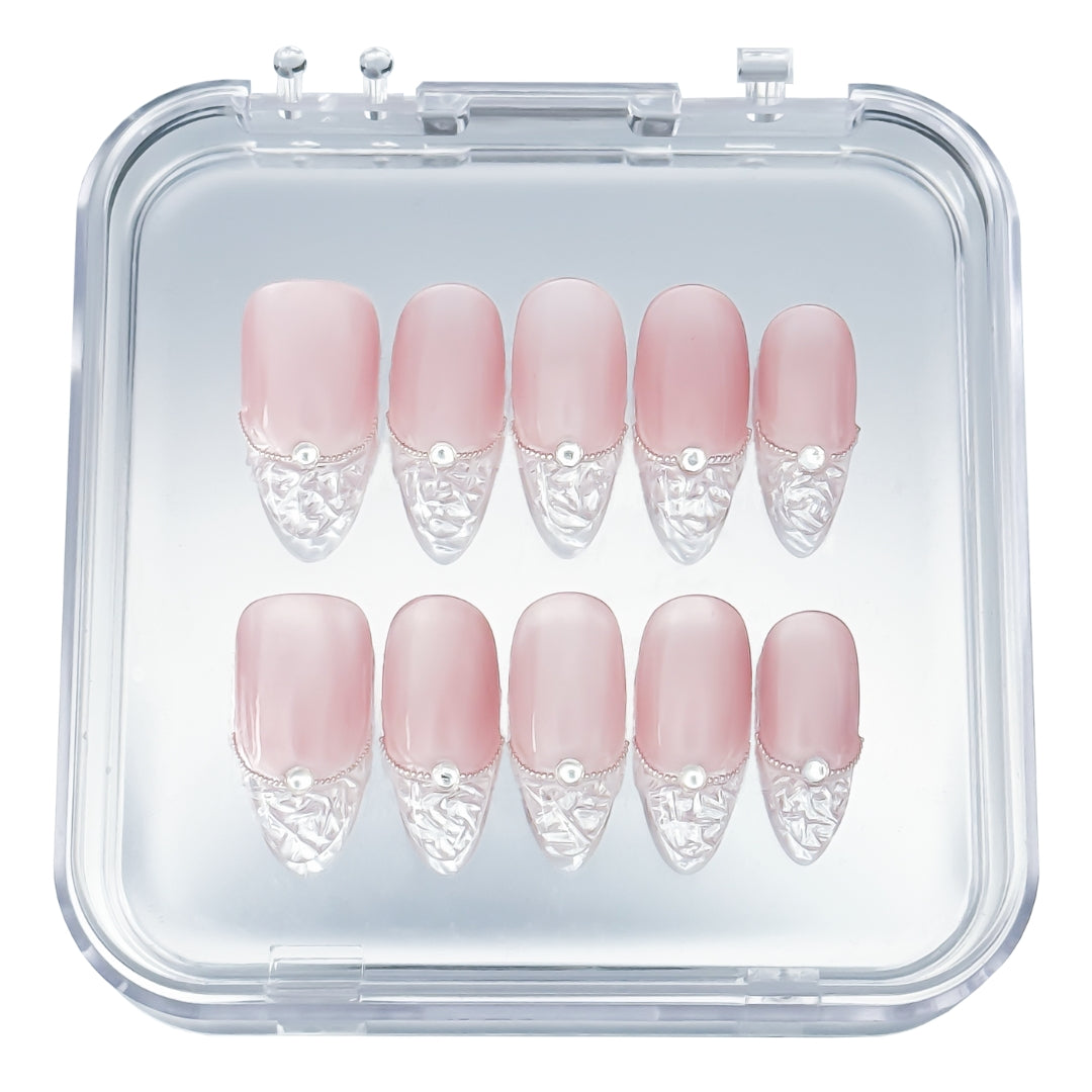 Crystal Cut press-on nails by Lunoxcore — a soft blush nude base with clear sculpted tips and crystal-like precision, elegantly displayed in a clear case.