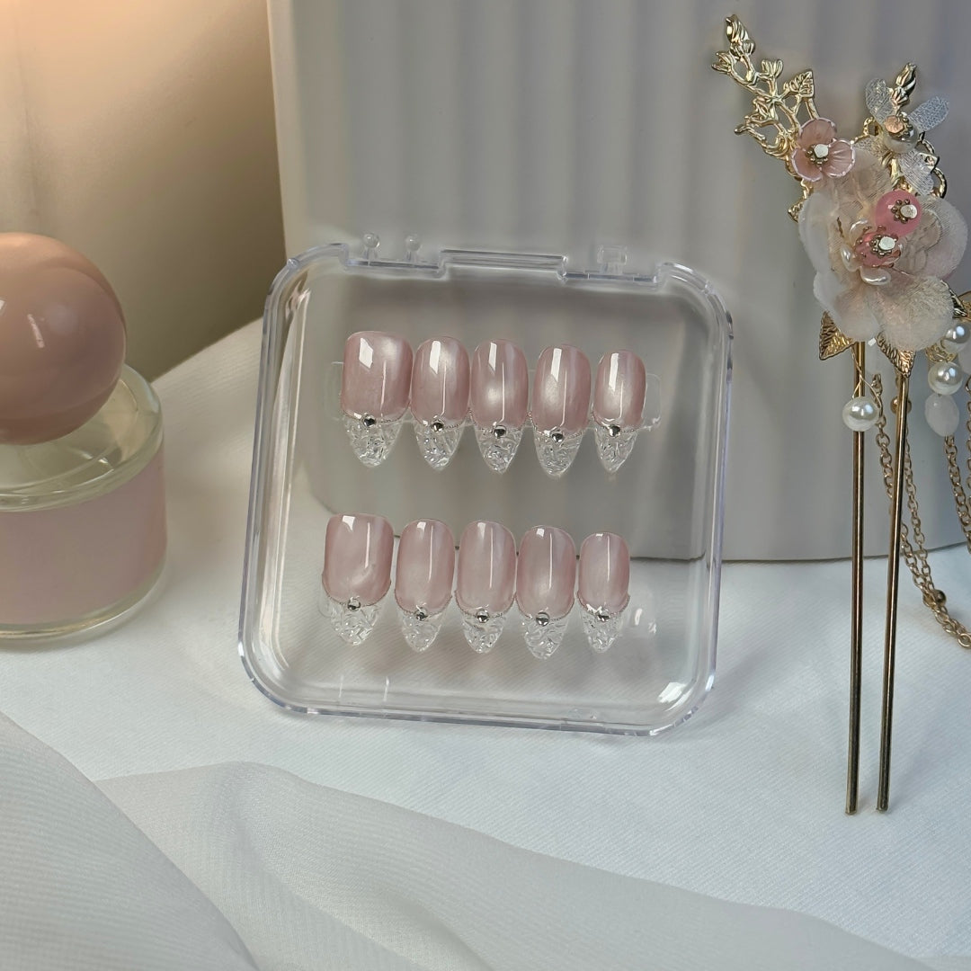 Crystal Cut press-on nails by Lunoxcore — a soft blush nude base with clear sculpted tips and crystal-like precision, elegantly displayed in a clear case.