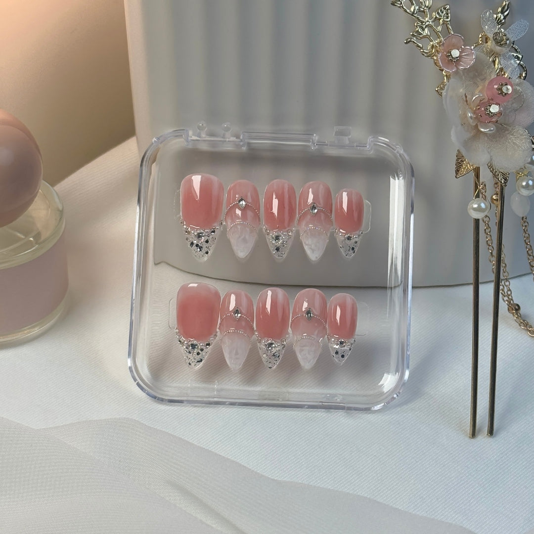 Dainty Drip press-on nails by Lunoxcore — soft blush pink base with crystal-clear tips, silver gem accents, and dainty shimmer for a refined, radiant look.