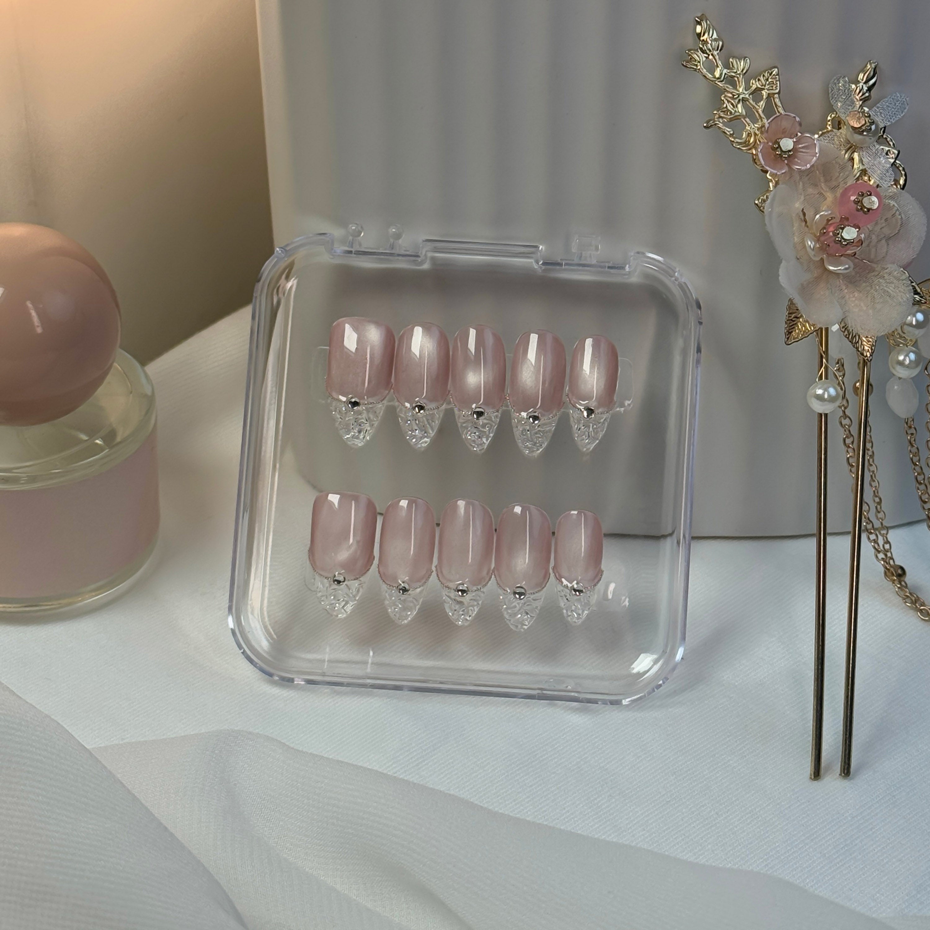 Lunoxcore Evening Glow collection — blush pink press-on nails with pearl and gem tips, designed for romantic sophistication and effortless evening charm.