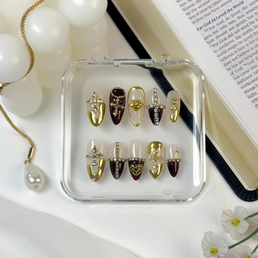 Lunoxcore Heavenly Light collection — gold and plum press-on nails with crystal accents, handcrafted to reflect divine radiance and bold elegance.