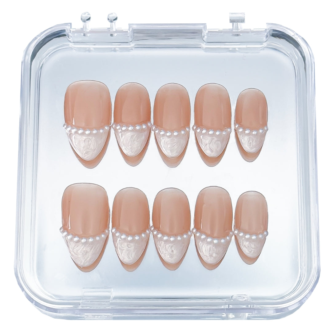 Pearl Veil press-on nails by Lunoxcore — soft nude base adorned with delicate white lace texture and a strand of pearls for timeless elegance.