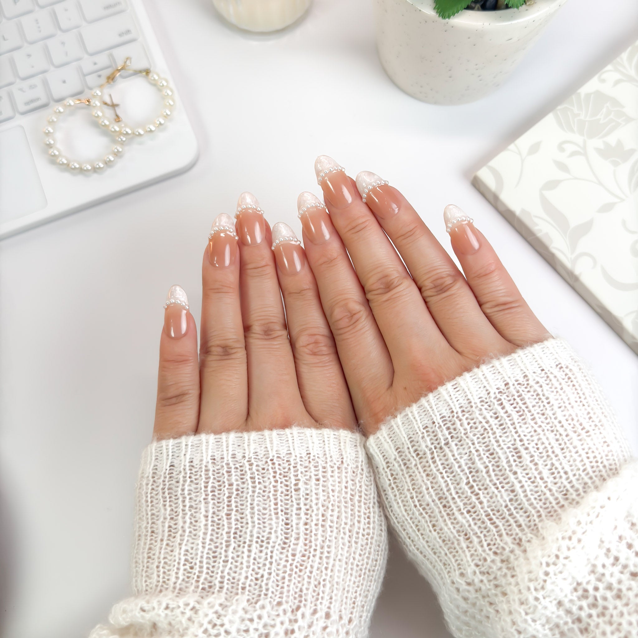 Pearl Veil press-on nails — handcrafted nude and white design with a line of pearls, bringing a romantic bridal-inspired aesthetic.