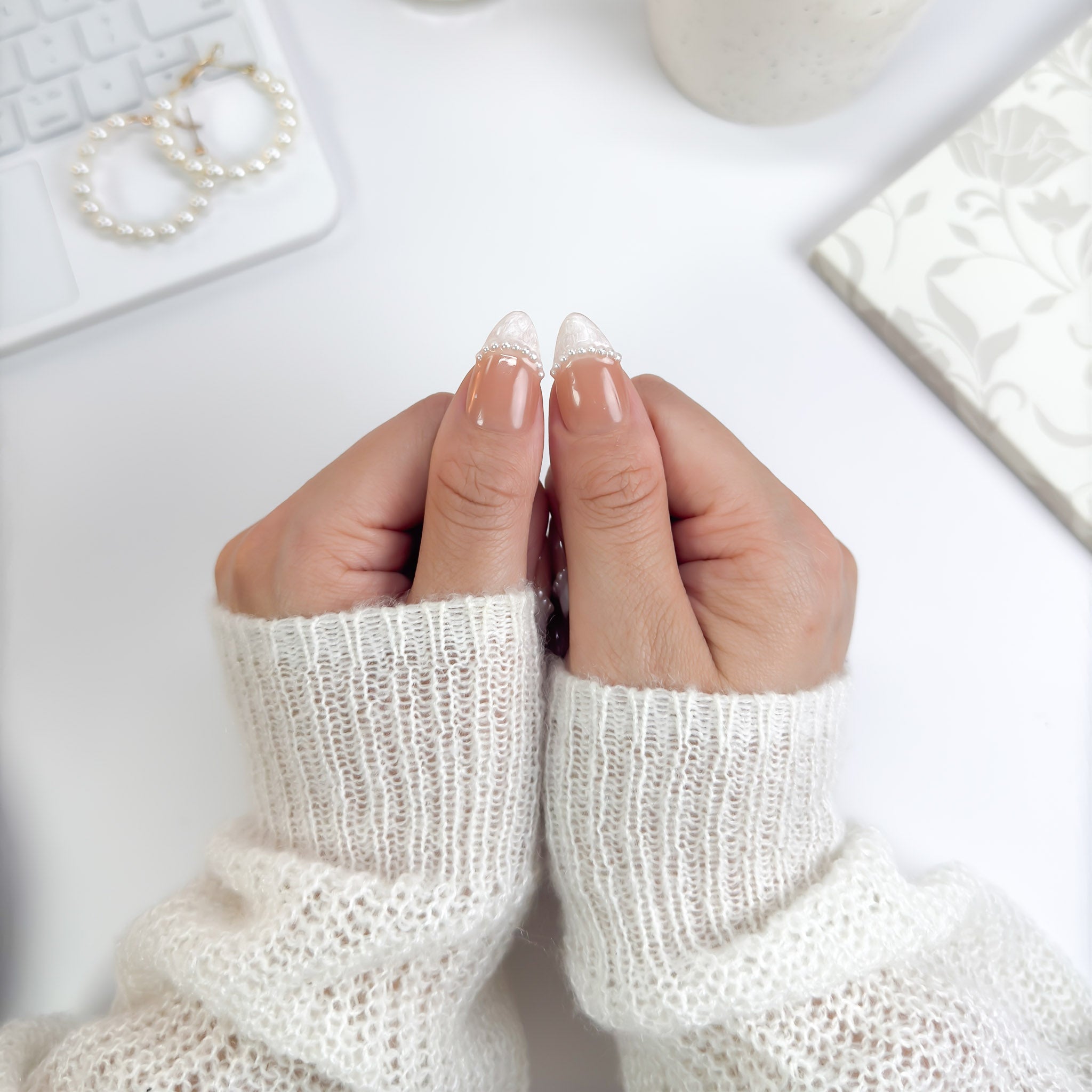 Close-up of Pearl Veil nails highlighting the 3D pearl embellishments and soft nude tones — elegant and feminine with subtle charm.