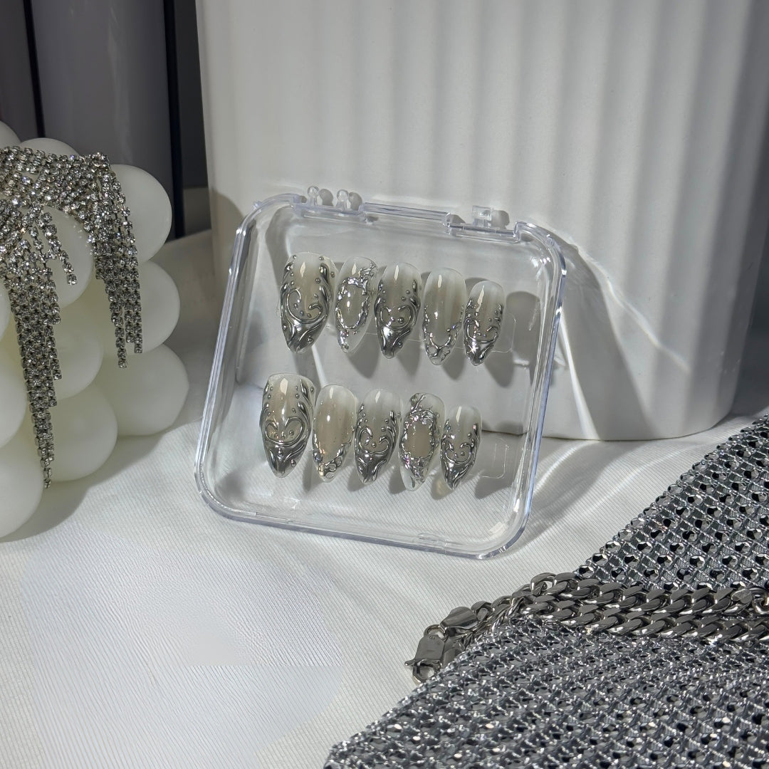 Lunoxcore Silver Circuit press-on nails — metallic silver and grey chrome design with futuristic circuit-inspired patterns from the Loudcore collection.