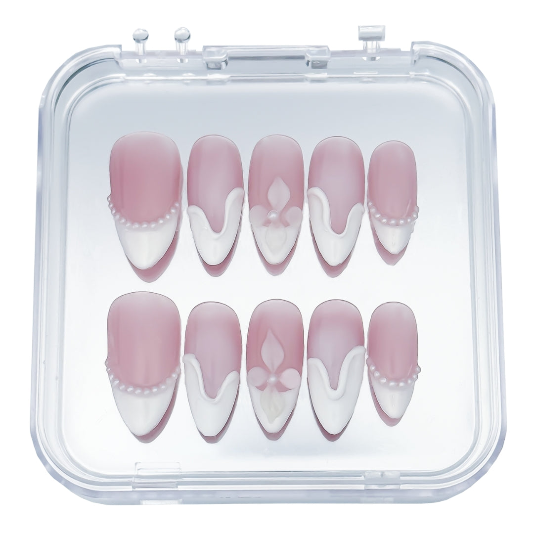 Soft Serve press-on nails by Lunoxcore — creamy blush pink with sculpted white swirls and delicate pearl details, blending sweetness with timeless elegance.