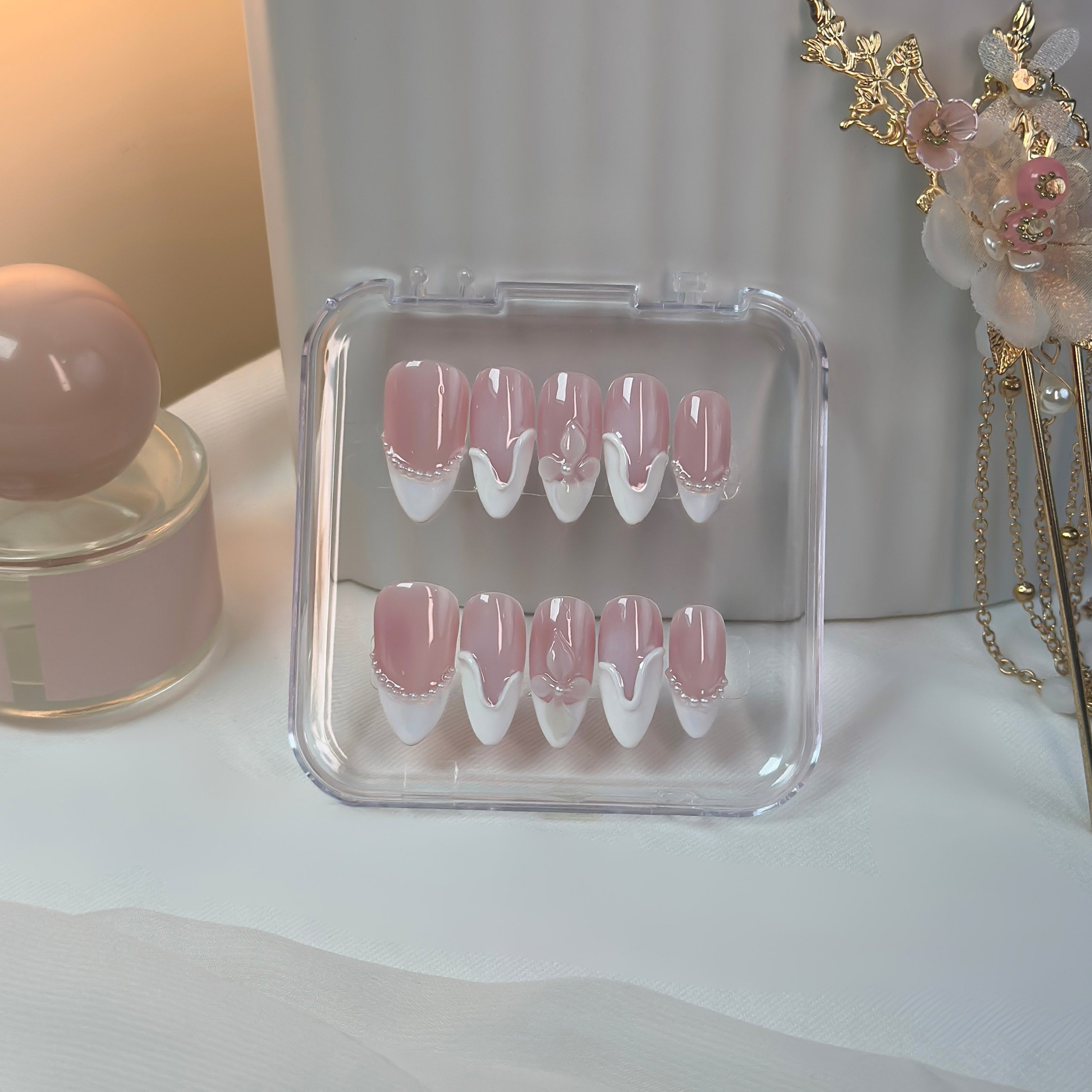 Soft Serve press-on nails by Lunoxcore — creamy blush pink with sculpted white swirls and delicate pearl details, blending sweetness with timeless elegance.