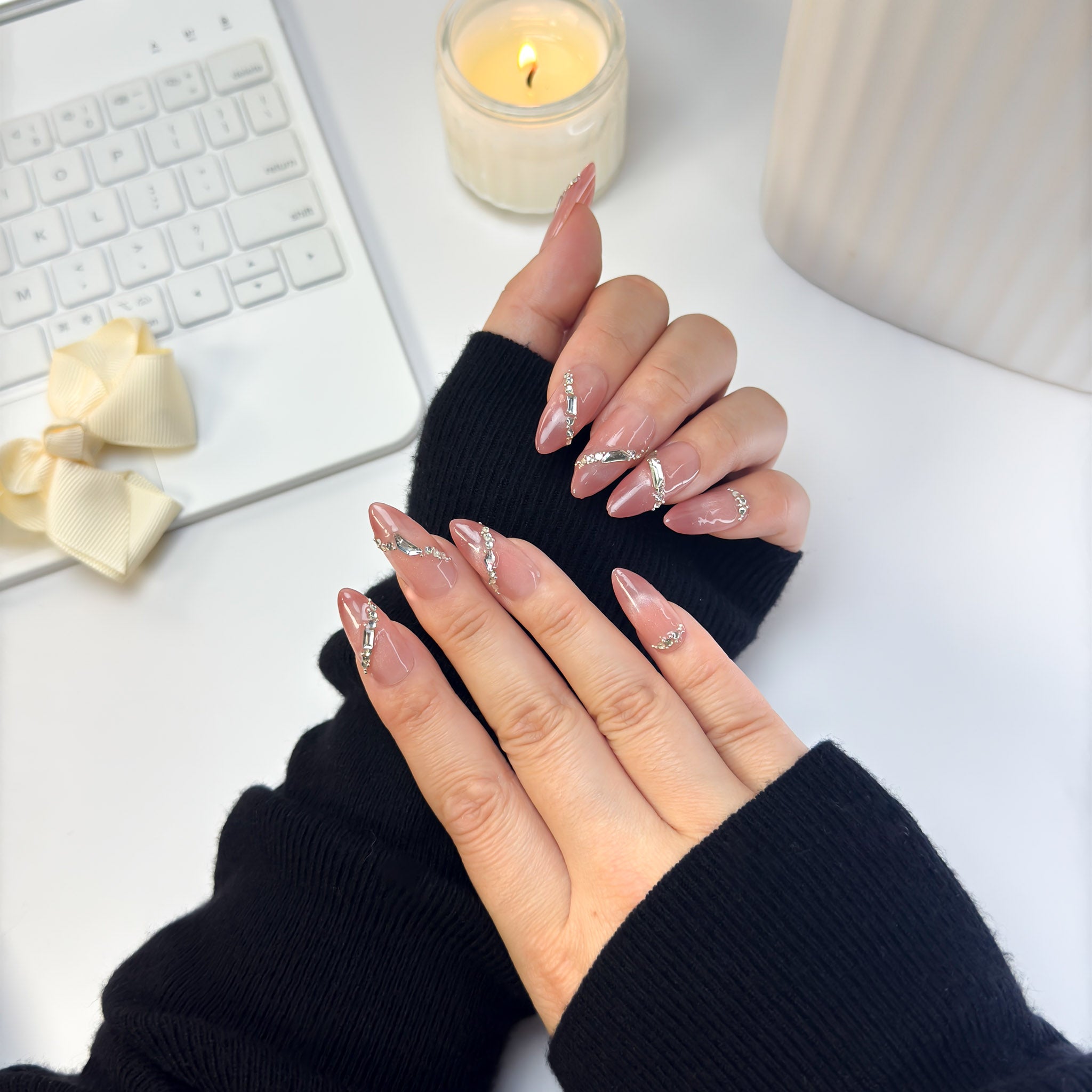 Sunlit nails captured from an angled view, highlighting their warm reflective finish and natural gradient under soft daylight.